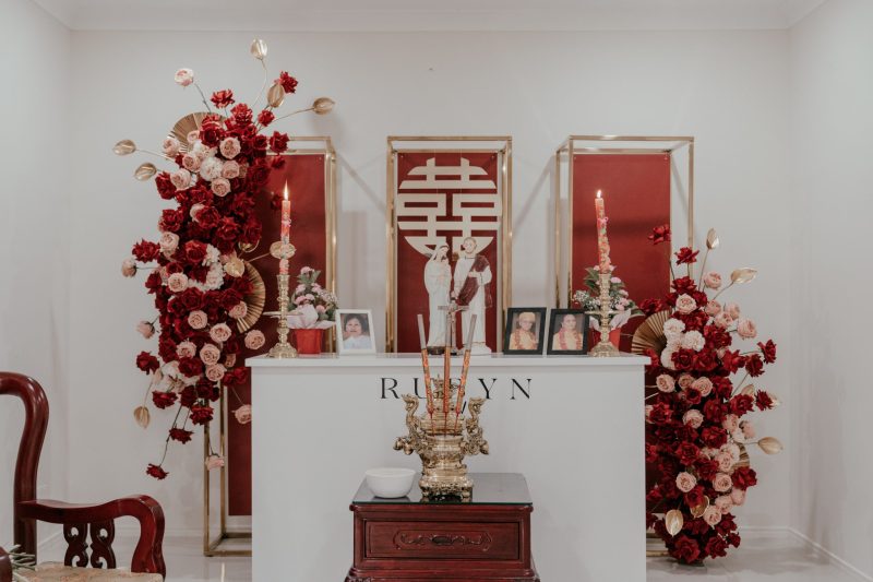 Oriental Tea Ceremony event backdrop design with double happiness signage and florals