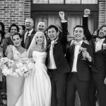 Bride and groom celebrating with their bridal party and guests outside The Valley Estate down the Gold Coast during a joyful wedding planned and styled by a Brisbane-based luxury wedding team.